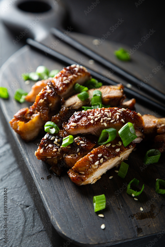 Poster chicken fried in soy sauce with chili and ginger