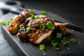 Chicken fried in soy sauce with chili and ginger