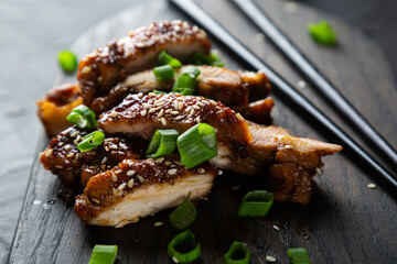 Chicken fried in soy sauce with chili and ginger