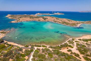 Fototapeta na wymiar Aerial view of the amazing colorful turquise waters of Antiparos island, cyclades Greece.