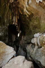 The atmosphere at Batu Cermin, one of the tourist destinations in Labuan Bajo, East Nusa Tenggara, Indonesia. There are caves with stalagmites and stalactites and arid conditions around them.