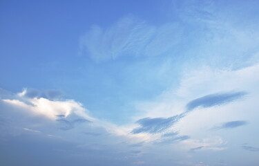 Naklejka na ściany i meble cloud spreading on bright sky in sunny day 
