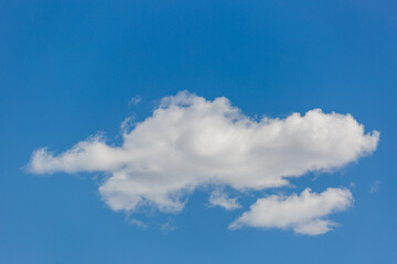 Fototapeta premium Beautiful white puffy clouds in a blue sky. A pretty cloudscape. Fresh, airy light and clean. Clouds above the Sonoran Desert in Tucson, Arizona, USA.