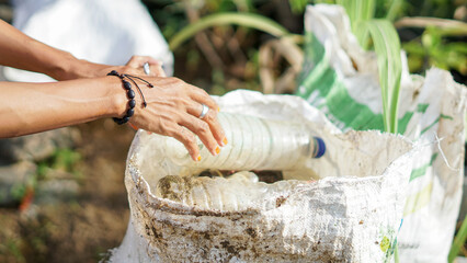 woman cleaning plastic waste around the house