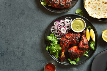 Tandoori chicken served with cilantro and onion