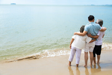 Happy asian family on the beach summer vacation. Vacation summer beach holidays background