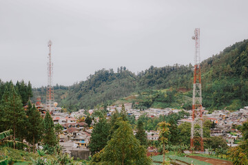 Obraz premium Two A cell tower in the mountains in clear weather