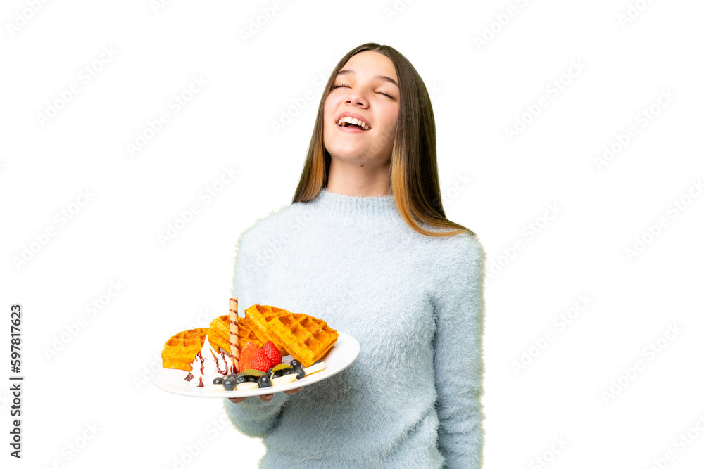 Poster Teenager girl holding waffles over isolated chroma key background laughing