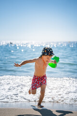 child playing on the beach