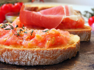 Toasted bread rubbed with fresh garlic and ripe tomato, then drizzled with olive oil