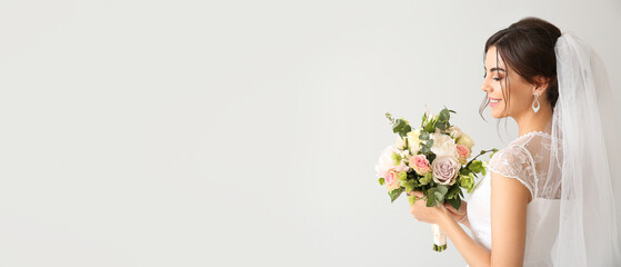 Beautiful young bride with bouquet of flowers on light background with space for text - Powered by Adobe
