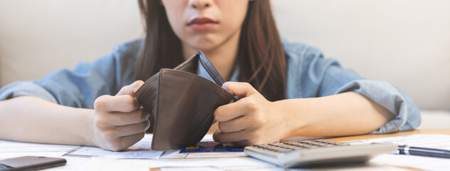 Stressed, Problem business person woman holding and open empty wallet, purse no have money for bill payment, credit card loan or expense. Bankruptcy, bankrupt or debt financial, mortgage concept.