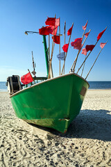 Fishing boat on a sandy beach in Międzyzdroje on the island of Wolin
