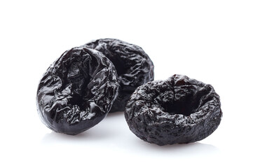 Dehydrated prunes in closeup on white background