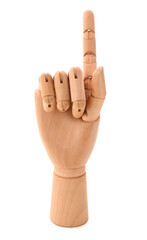 Wooden hand with raised index finger on white background