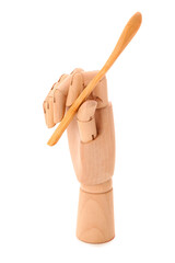 Wooden hand with spoon on white background