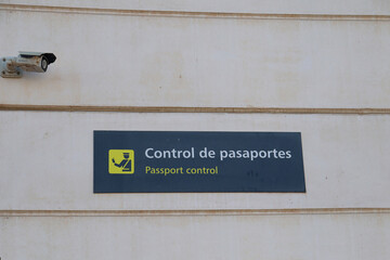 Passport Control Sign in Airport in Spanish and English
