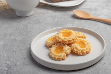 Orange cookies on a white plate