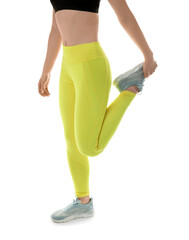 Sporty young woman in leggings on white background