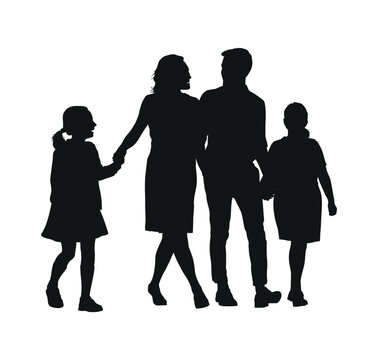 Parents walking together with two daughter outdoor silhouette.