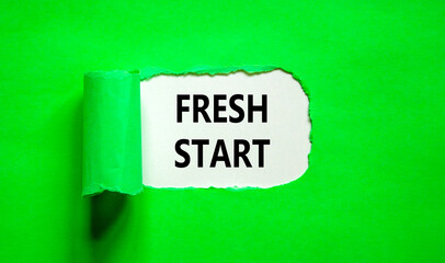 Fresh start and motivational symbol. Concept words Fresh start on beautiful white paper. Beautiful green table green background. Business motivational and Fresh start concept. Copy space.