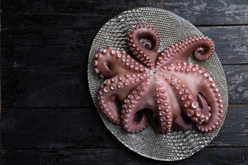 A close up of an octopus on a metal tray