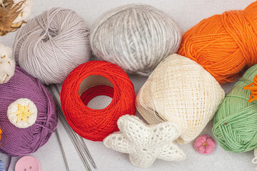 A set of colorful clew of thread for knitting and special craft tools. Handmade, hobby concept