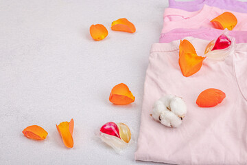 Eco friendly spring closet cleaning, capsules for machine washing. Pastel T-shirts, sale concept