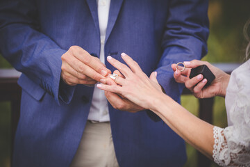 Intimate Moment of a couple Exchanging Wedding Rings at a wedding