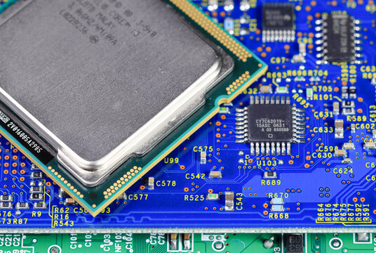 Close up of High performance CPU or central processor unit on electronic board background.