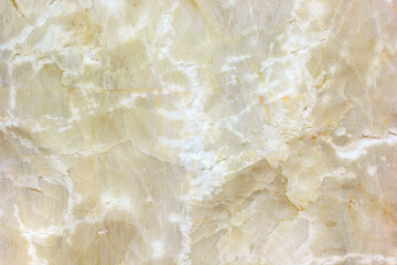 Natural raw yellow marble floor backdrop.