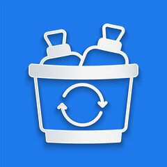 Paper cut Recycle bin with recycle symbol icon isolated on blue background. Trash can icon. Garbage bin sign. Recycle basket sign. Paper art style. Vector