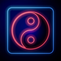 Glowing neon Yin Yang symbol of harmony and balance icon isolated on black background. Vector