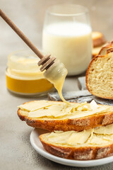 bread with butter and honey. breakfast food concept