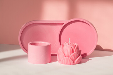 Home decor pink plates and a handmade lotus candle.