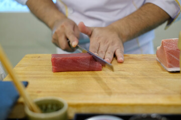 chef cutting meat