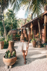 Girl in front of a Mexican house in Tulum