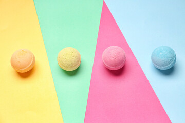 Bath bombs on color background