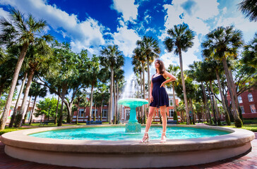 Stetson University Holler fountain woman in blue dress gazing off into the future 