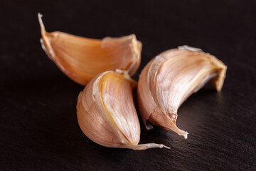 White garlic isolated on black background. Vegetable