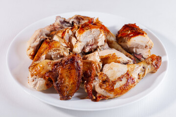 Sliced fried chicken on a white plate