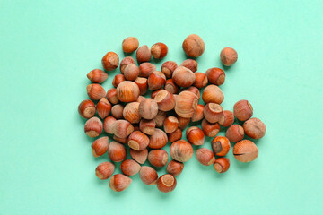 Shelled hazelnuts on blue background