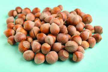 Shelled hazelnuts on blue background