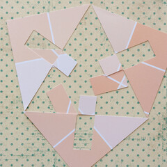 Naklejka premium geometric paper cutouts on scrapbook paper with dots