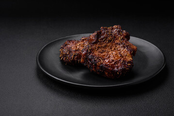 Delicious beef or pork steak on the bone grilled with spices and rosemary