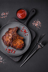 Delicious beef or pork steak on the bone grilled with spices and rosemary