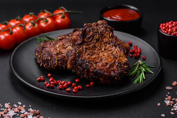 Delicious beef or pork steak on the bone grilled with spices and rosemary