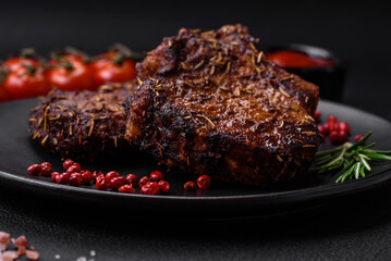 Delicious beef or pork steak on the bone grilled with spices and rosemary