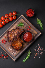 Delicious beef or pork steak on the bone grilled with spices and rosemary