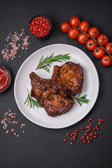 Delicious beef or pork steak on the bone grilled with spices and rosemary